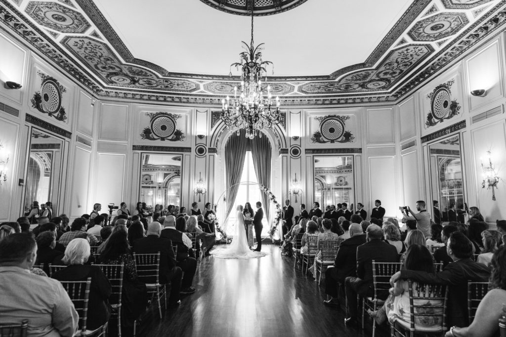 wide angle photo of a wedding ceremony at the Colony Club Detroit