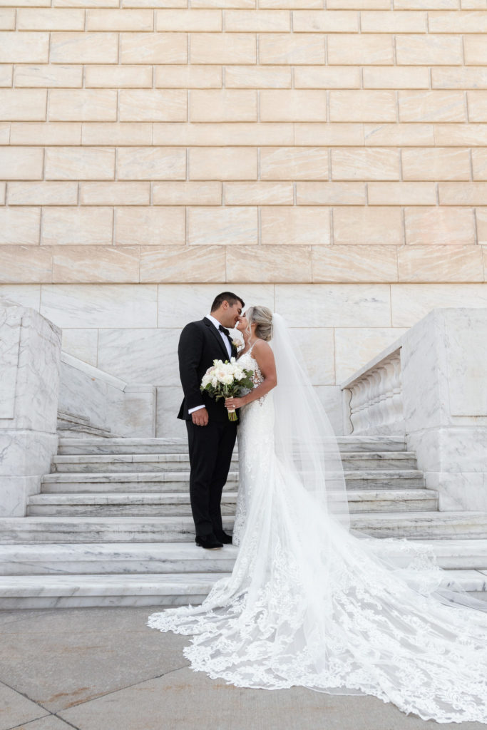 bride and groom portrait on the steps of the Detroit Institute of Arts
