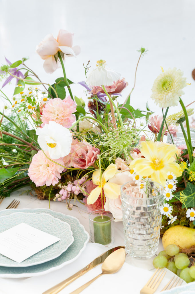 yellow and pink reception table centerpieces at a spring wedding