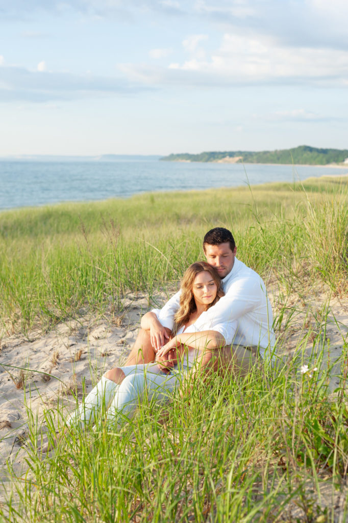 couple sitting in tall beach grass