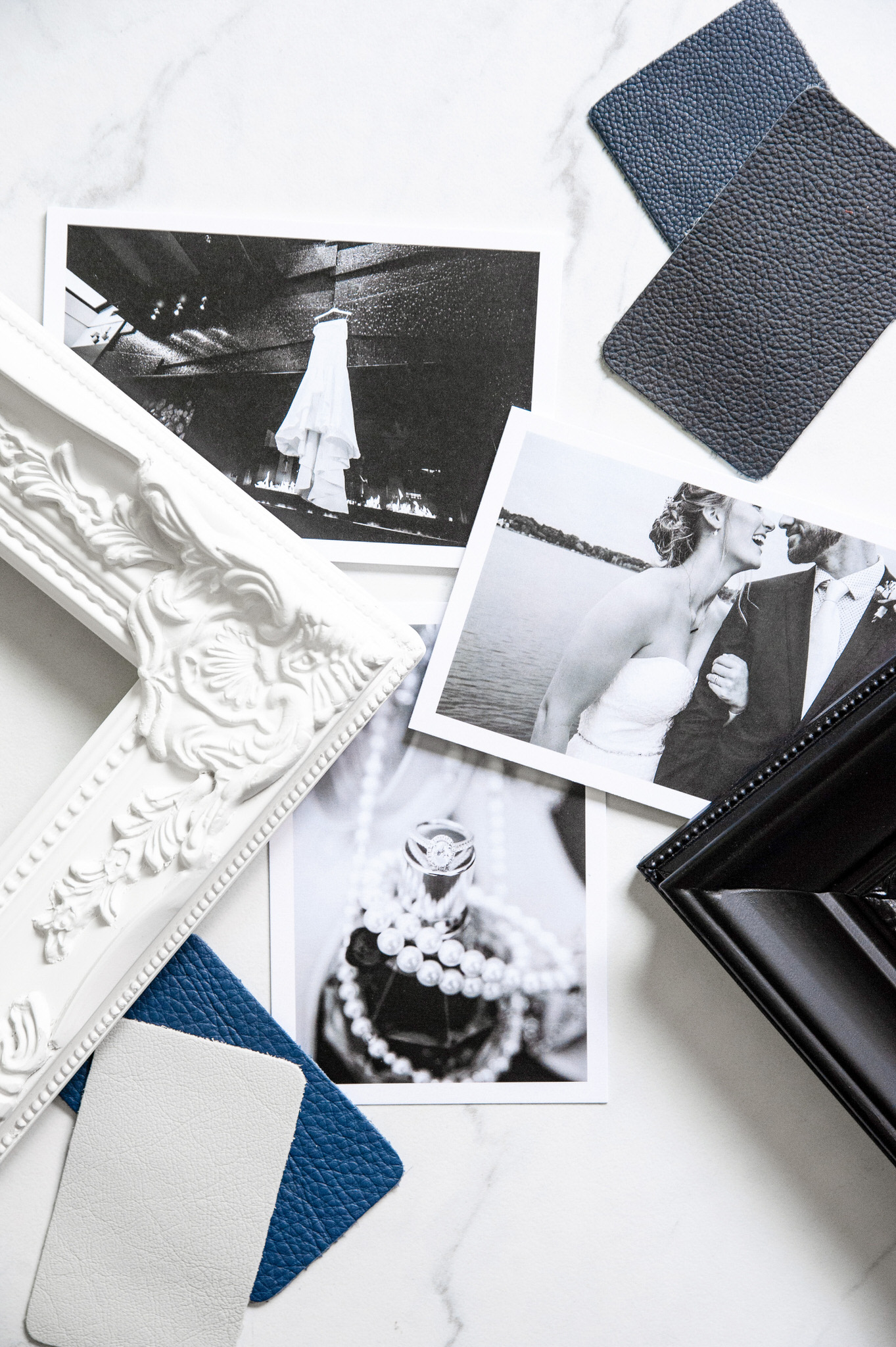 black and white printed photos next to a black and white frame