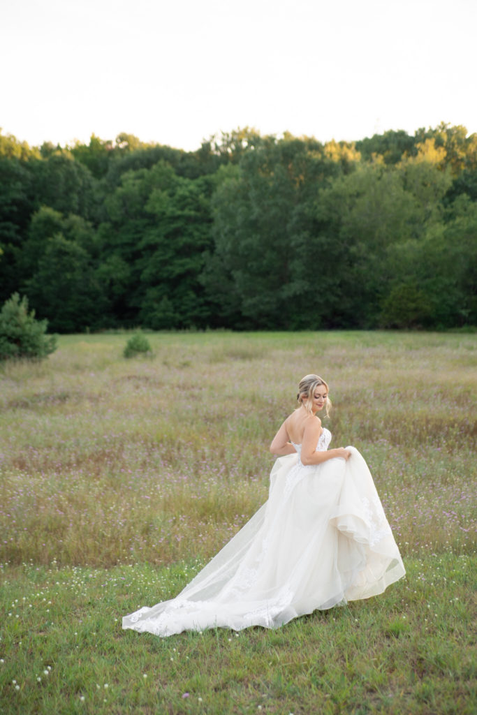 bride walking through a field in West Michigan
