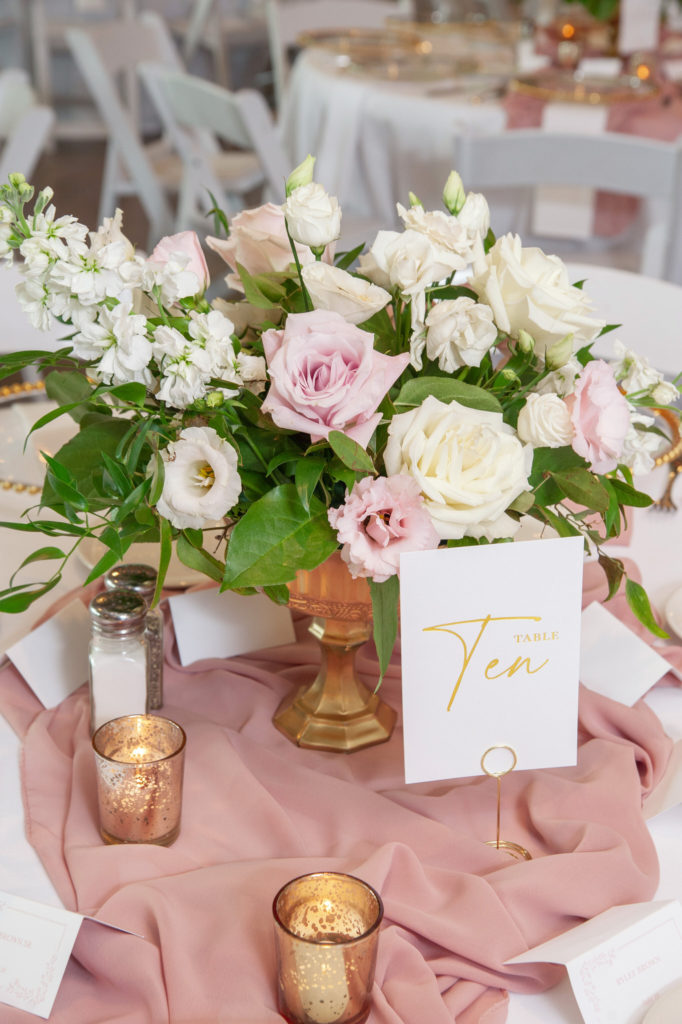 pink, gold and white wedding reception centerpiece