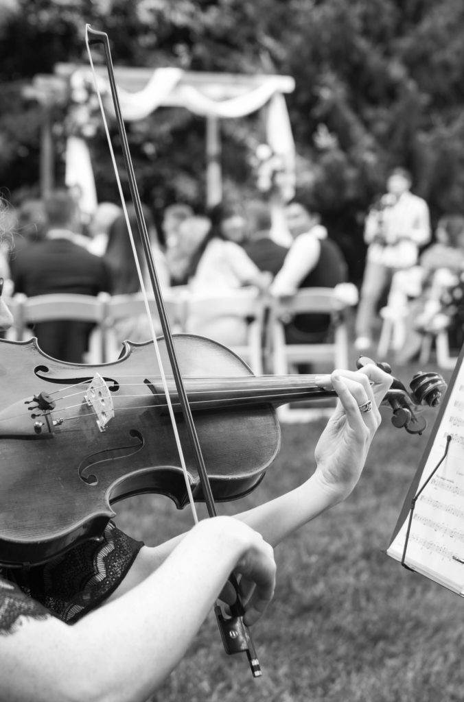 black and white picture of woman playing a violin