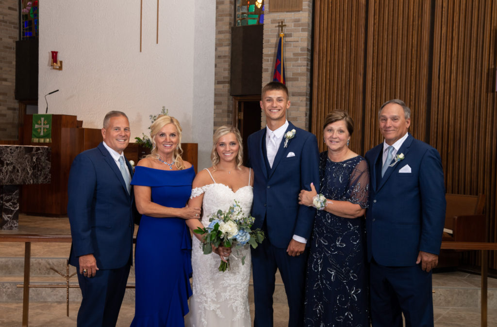 family photo after the bride and groom's summer wedding at St. Michael's Lutheran Church