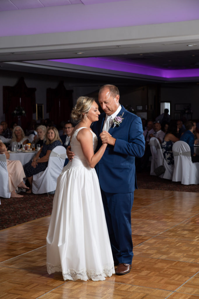 father and daughter dance in the ballroom at the Bavarian Inn Lodge