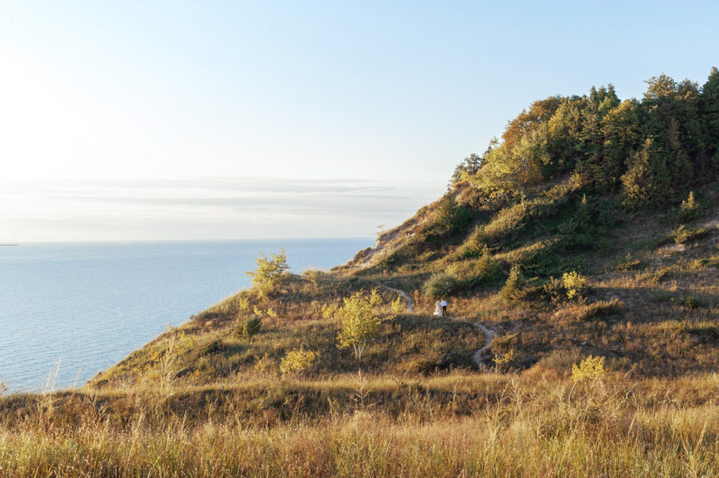 Wide angle view of a wedding elopement at Lake Bluff Preserve in Frankfort Michigan