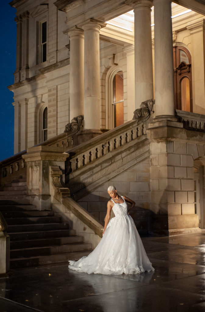 African American bride in a ballgown wedding dress at the capitol building in Lansing, Michigan