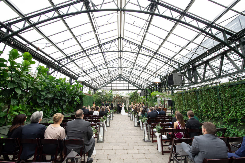 wide angle view of a romantic wedding reception at the Planterra Conservatory