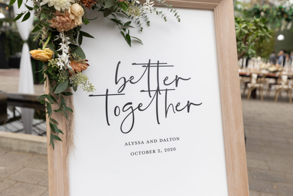 fall wedding welcome sign that says better together