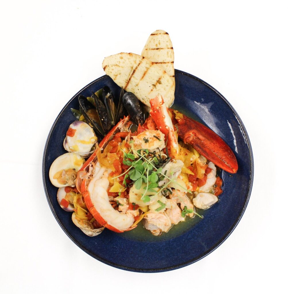 fresh seafood meal in a blue bowl