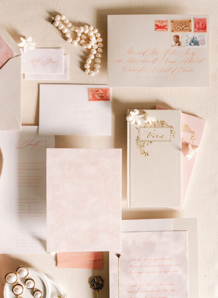 pink and gold flat lay of wedding details by Charleston wedding photographer, Kaitlyn Cole
