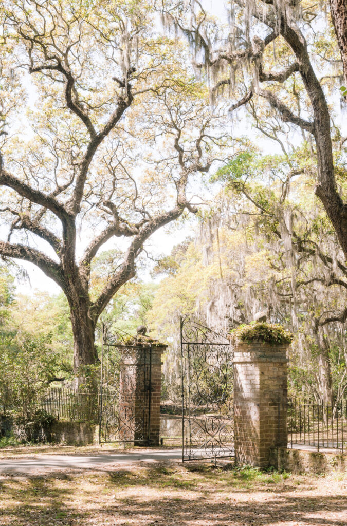 pathway with metal gates leading towards the Legare Waring House in Charleston South Carolina