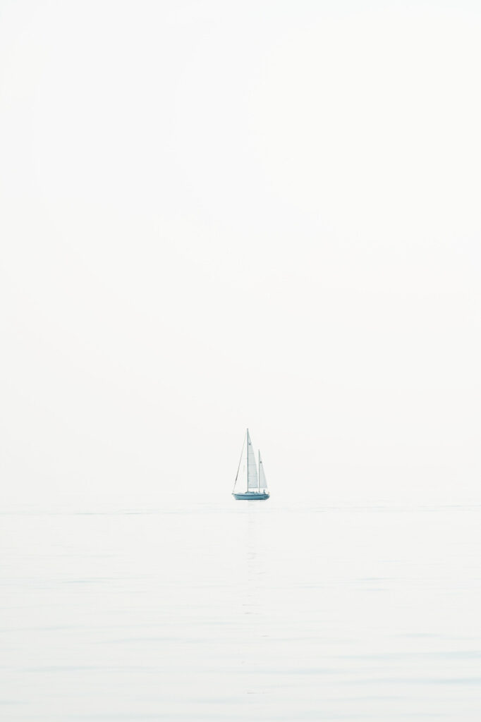 a lone sailboat sailing on Lake Michigan