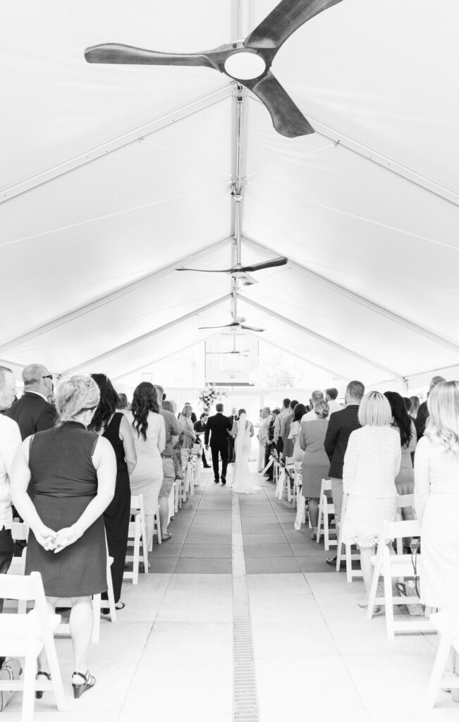 wide angle view of a courtyard wedding ceremony at the H Hotel in Midland, Michigan