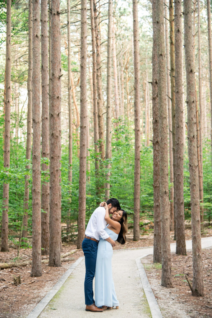 couple hugging each other on the trails of Rosy Mound Natural Area in Grand Haven, Michigan
