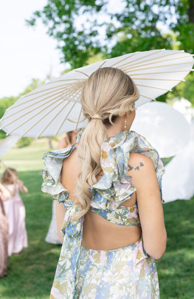 colorful bridesmaid dress and a white parasol for an English garden party theme Waldenwoods Wedding in Michigan