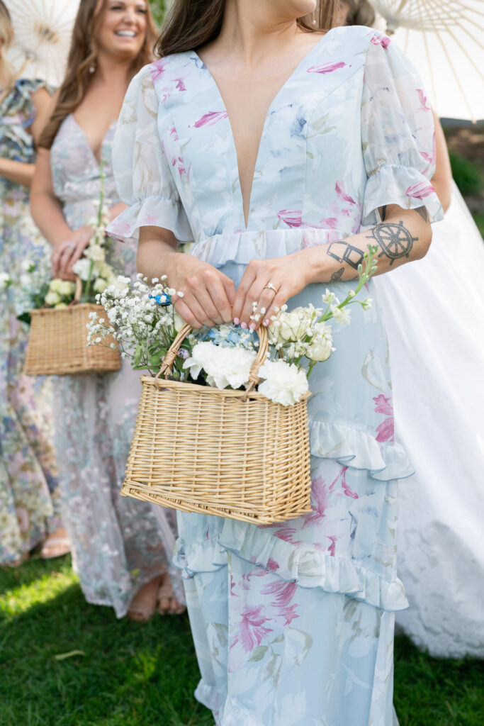 spring garden party bridesmaid dresses and whicker basket floral bouquets