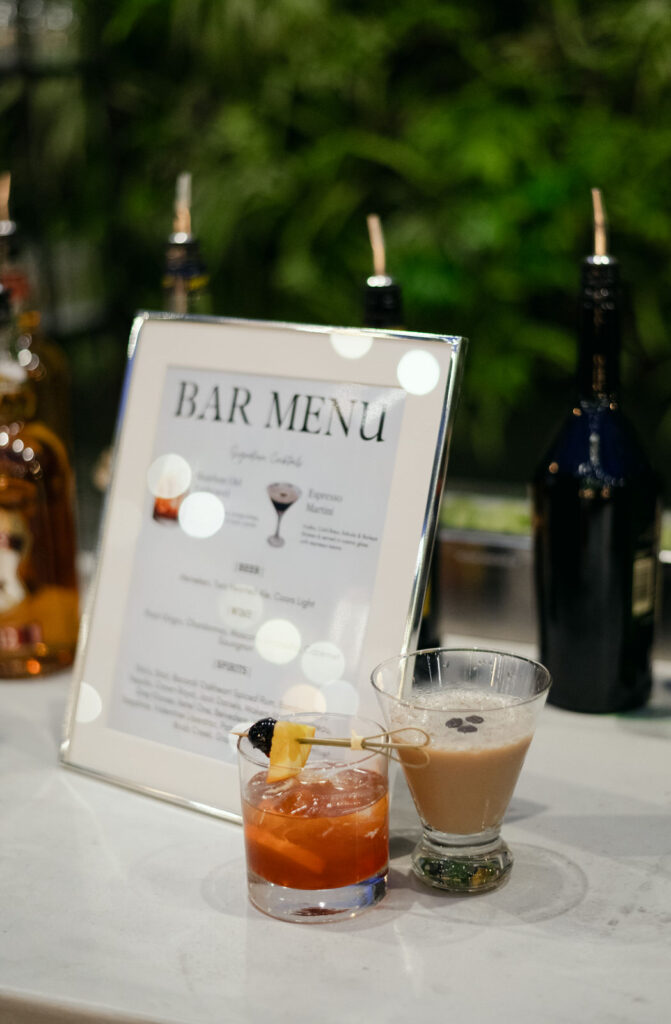 bar menu at a wedding reception featuring an espresso martini and an old fashioned cocktail