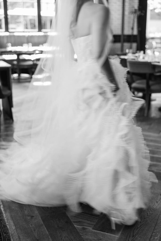 bride spinning and twirling her Ines Di Santo gown at the Detroit Foundation Hotel