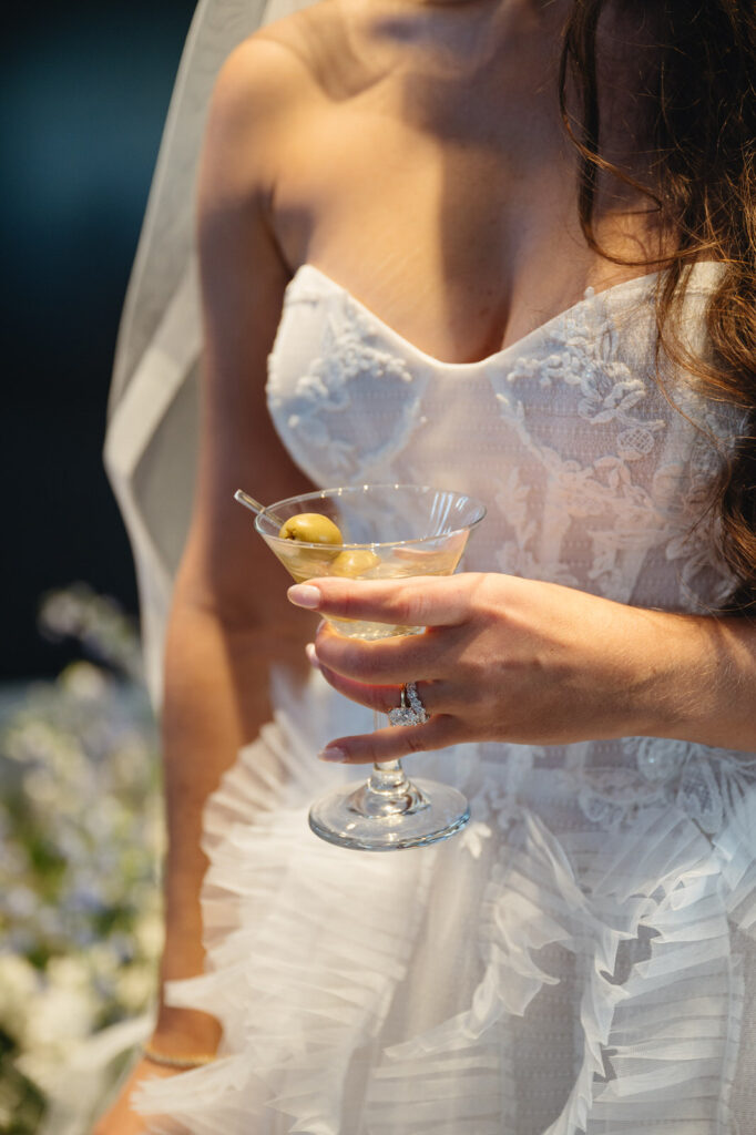 bride holding a dirty martini during her cocktail hour at Chroma Detroit 