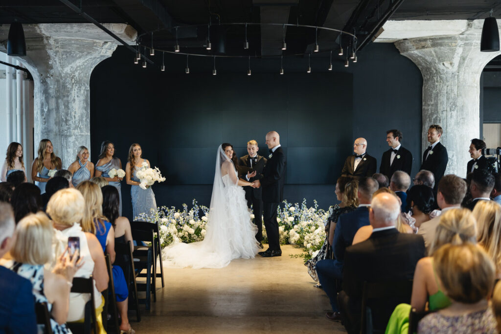 bride and groom get married during their ceremony at Chroma Detroit in August