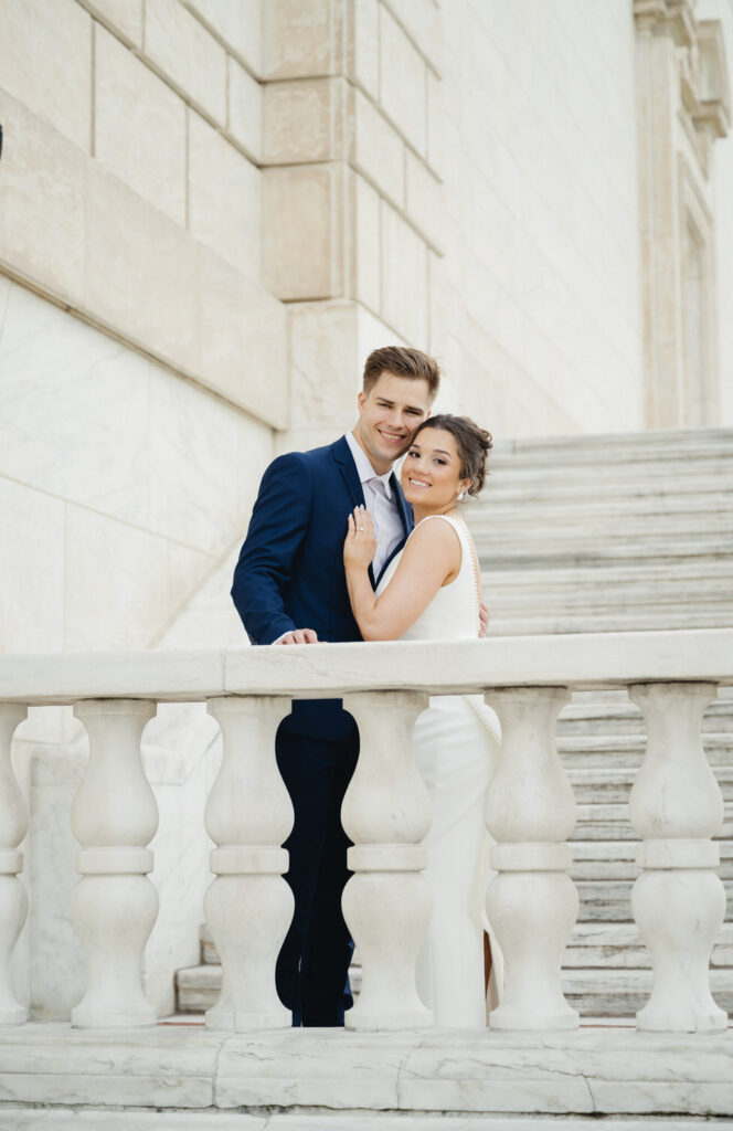engagement photos on the white marble stairs of the Detroit Institute of Arts