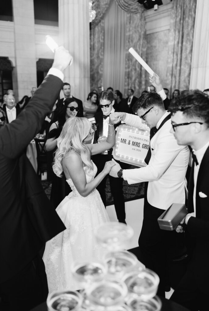 bride and groom dance during their grand entrance to their Ballroom at McKay wedding reception